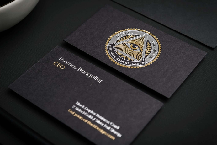 Black business cards with gold and silver stamping